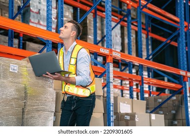 Smart Smiling Caucasian Warehouse Man,worker,manager Use Laptop To Check Goods On Shelf For Product Distribution Stock Management, Logistics Shipping Business Planning Concept With Copy Space