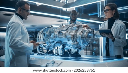 Smart Team of Engineers, Tech Scientist and Machinery Operators Collaborate on a New Type of a Electric Turbine Engine, Using Computers and Measuring Tools in Scientific Technology Lab