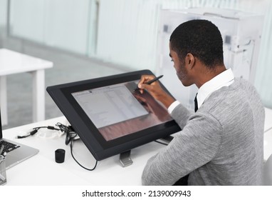 Smart Technology Makes Everything Easier. A Young Man Working On A Large Touchscreen.