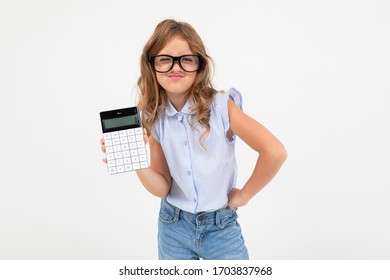 smart teen girl holding a calculator in hand on a white background with copy space