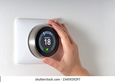 Smart Thermostat With A Hand Saving Energy