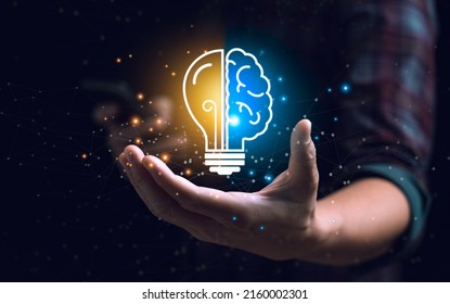 Smart Thinking Idea And Inspiration Innovation Concept. Businessman Holding Half Brain Icon And Light Bulb. Solve Problems Intelligently