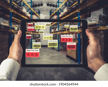 Smart warehouse management system using augmented reality technology to identify package picking and delivery . Future concept of supply chain and logistic business .