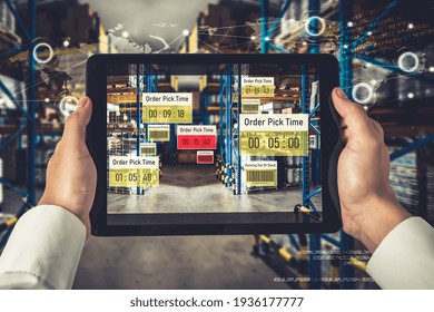 Smart warehouse management system using augmented reality technology to identify package picking and delivery . Future concept of supply chain and logistic business .