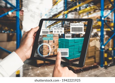 Smart warehouse management system using augmented reality technology to identify package picking and delivery . Future concept of supply chain and logistic business .