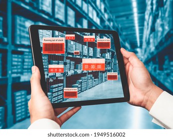 Smart warehouse management system using augmented reality technology to identify package picking and delivery . Future concept of supply chain and logistic business .