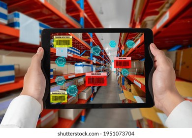Smart warehouse management system using augmented reality technology to identify package picking and delivery . Future concept of supply chain and logistic business .