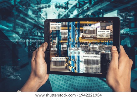 Smart warehouse management system using augmented reality technology to identify package picking and delivery . Future concept of supply chain and logistic business .