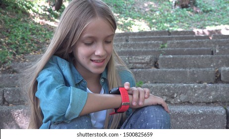 Smart Watch, Child Using Smartwatch Outdoor In Park, Kid Talking At Smartphone