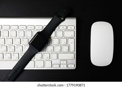 the smart watch is on the wireless keyboard