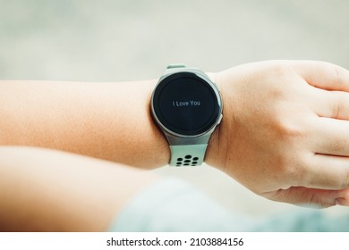 Smart watch show text I Love You. Valentine day Concept. smartwatch with email on the screen. Smartwatch with message on the screen. Message I Love You.	