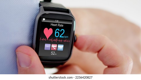 Smart Watch Showing Heartbeat Monitor On Man's Hand - Shutterstock ID 2236420827