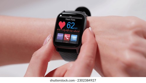Smart Watch Showing Heartbeat Monitor On Woman's Hand - Shutterstock ID 2302384927