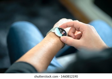 Smart Watch, Wearable Gadget. Man Wearing Hybrid Smartwatch. Wearables With Digital Touchscreen And Mobile App Technology. Person Using Wristwatch For Business And Work. Device With Touch Interface.