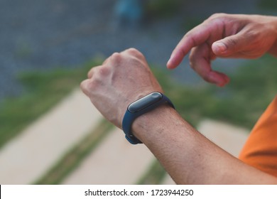 Smart Watch Wearable Tech Device Fit Athlete Man Checking Smart Sport Watch Technology On Fitness Run Jog Outside.Concept Of The Technology To Check Health While Exercising.