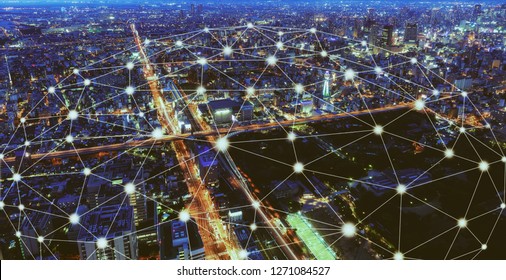 Smart Wireless Network And Connection Technology Concept With Osaka City Background At Night In Japan, Panorama View