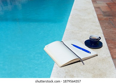 Smart Working Poolside  - Agenda, Pen And Espresso Cup Half-filled With Coffee, Resting On Border Of Vibrant Turquoise Blue Swimming Pool