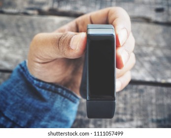 Smart wristband and hand - Shutterstock ID 1111057499
