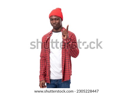 smart young african man in red plaid shirt pointing with index finger at idea over isolated white background