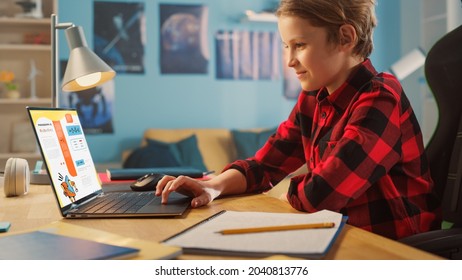 Smart Young Boy Researching Homework Topic from an Exercise Book on Laptop Computer. Happy Teenager Browsing Educational Research, Chatting on Social Media, Studying School Material.