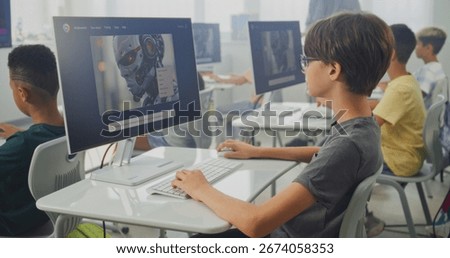 Smart Young Boy Using Computer, Creating Digital Illustration in AI Image Generator. Elementary School Children Learning Artificial Intelligence During Digital Art Lesson. STEM Education. Static Shot.