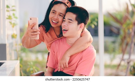 A smart young man with smiling face using social media with parent to learning distance,Teenage boy use technology,social media,live,video chat,remote education,Homeschool Concept. - Shutterstock ID 2250625747
