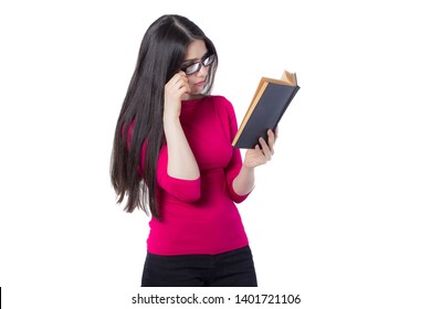 Smart young student woman in red shirt and glasses reading black book holding in one hand, on white background, interested woman concept idea