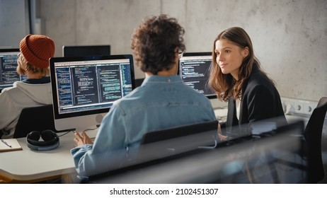 Smart Young Students Studying in University with Diverse Multiethnic Classmates. Scholars Collaborate in College Room on Computer Science Project, Writing Software Code in Successful Teamwork. - Shutterstock ID 2102451307