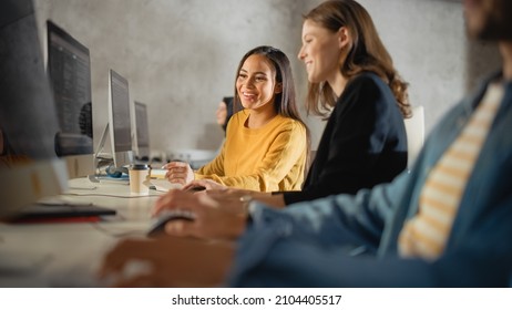 Smart Young Students Studying In University With Diverse Multiethnic Classmates. Scholars Collaborate In College Room With Computers. Applying Knowledge To Acquire Academic Skills In Class.