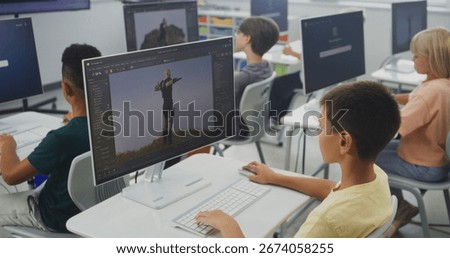 Smart Young Students Using Computers, Creating Game Characters in Design Software, Practicing 3D Modeling. Elementary School Children Learning Animation, Game Development, Digital Art. STEM Education.
