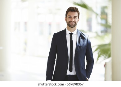 Smartly dressed businessman, smiling