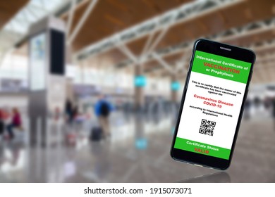 Smartphone App Shows Covid-19 Vaccination Certificate With Airport Background And Copy Space. Concept Of Future Air Travel New Normal With Proof Of Coronavirus Vaccination Requirement Before Boarding.