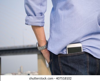 Smartphone in the back pocket of blue jeans