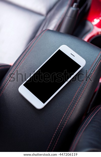 smartphone with a blank screen in car for text\
and content