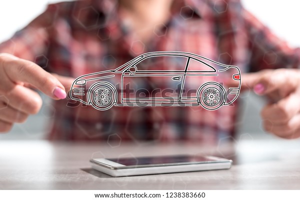 Smartphone with car transport concept between\
hands of a woman in\
background