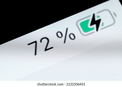 Smartphone Charged Pixel Battery Level Indicator - Charging Process - Seventy-two, 72 Percent: Close Up Macro View Of Gadget Display, Screen. Energy, Technology, Power, Digital And Symbol Concept