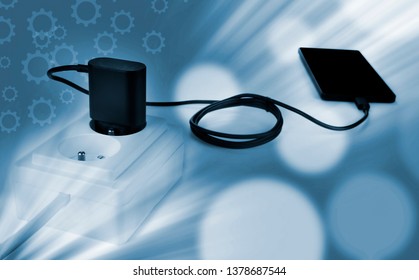 Smartphone charger plug in the socket