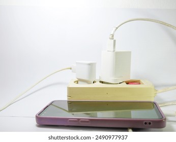 Smartphone charging with cable, one charging cable is broken, isolated on white - Powered by Shutterstock