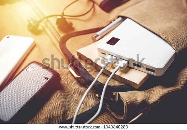 smartphone charging with white power bank. close-up at\
white power bank. 