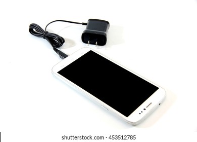 Smartphone connect with charger isolated on a white background. - Shutterstock ID 453512785