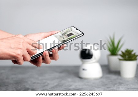 Smartphone connecting with security IP camera, Home IP video surveillance concept, Security camera.IP Camera.                           