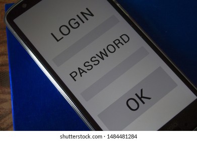 smartphone displaying generic application with user and login app in screen, on table with dramatic lighting