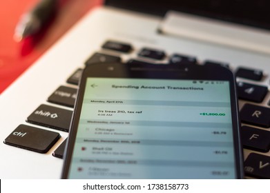 Smartphone displays a bank direct deposit from the IRS for a Coronavirus Economic Stimulus Payment in Chicago, USA on May 20, 2020.