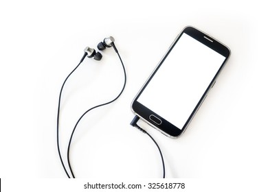 Smartphone and earphones on white paper background. Headphones, Music
 - Shutterstock ID 325618778