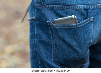 Smartphone In Faded Jeans Back Pocket