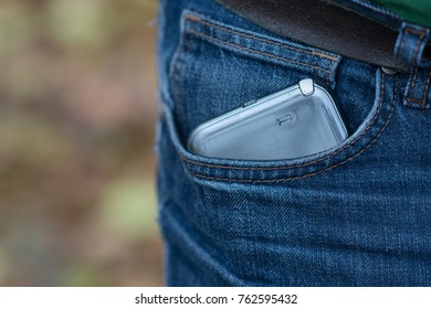 Smartphone In Faded Jeans Back Pocket