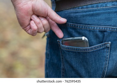 Smartphone In Faded Jeans Back Pocket