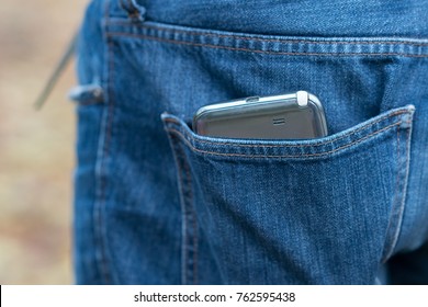 Smartphone In Faded Jeans Back Pocket