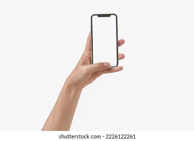 Smartphone in female hands taking photo isolated on white blackground - Shutterstock ID 2226122261