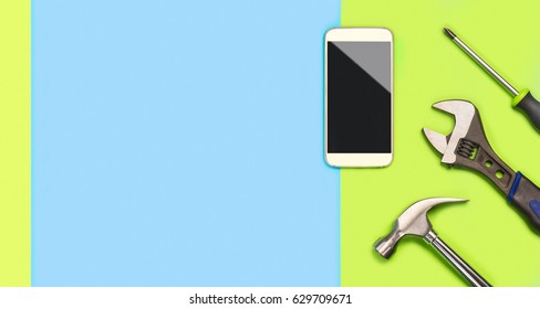 Smartphone Fix Background Banner With A Lot Of Free Blank Copy Space For Text And Content For Mobile Phone Repair Company. Cellphone And Tools On Fun And Colorful Vibrant Light Green And Blue Table.